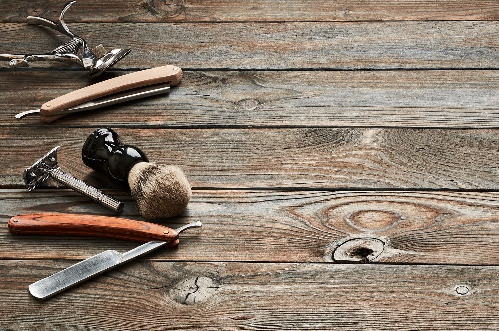 vintage barber shop tools on wooden background PY474UX